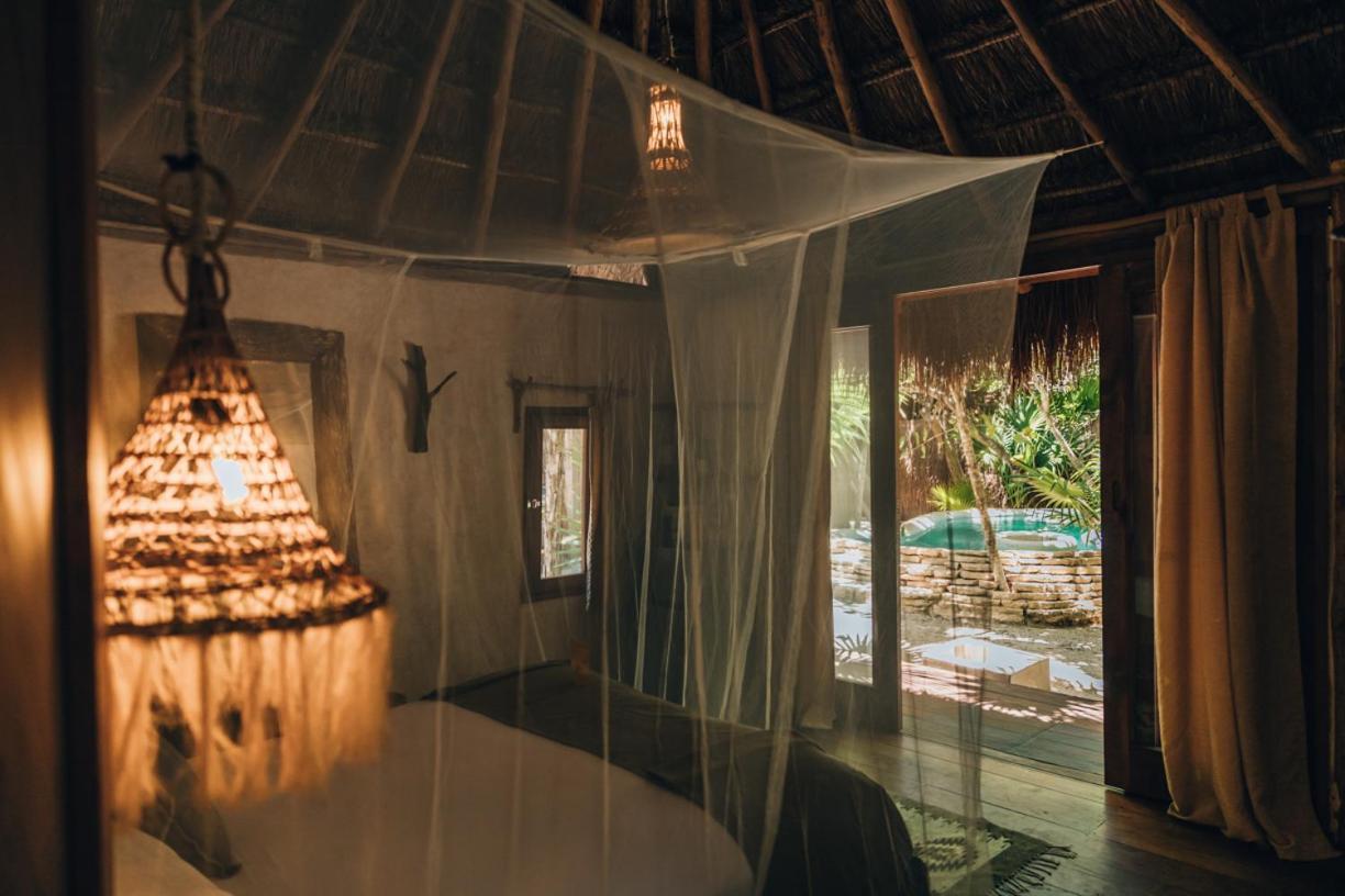 Ikal Tulum Hotel Exteriör bild Interior of a bungalow